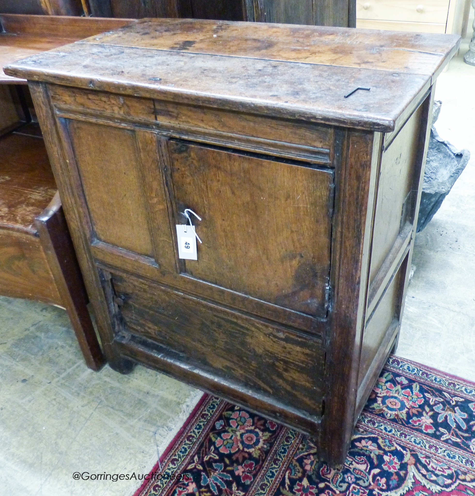 A 17th century oak low cupboard of rectangular form